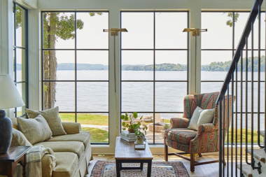 modernizing your walloon lake home must have features large windows in living room overlooking waterfront custom built michigan