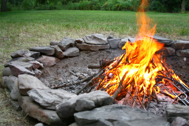 fire pit area designs for your northern michigan backyard rustic stone circle campfire custom built boyne city