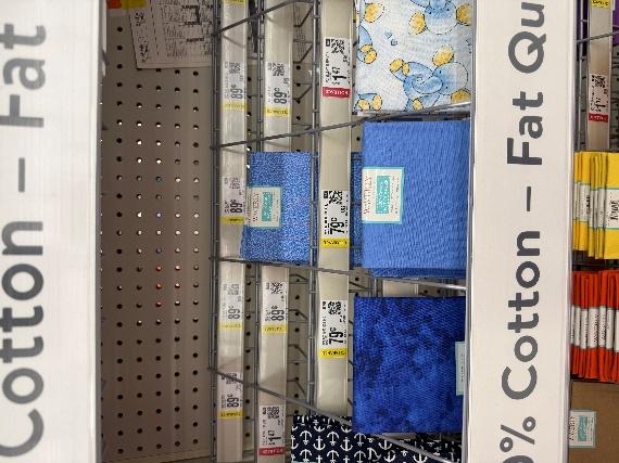 A shelf with blue fabric on it

AI-generated content may be incorrect.