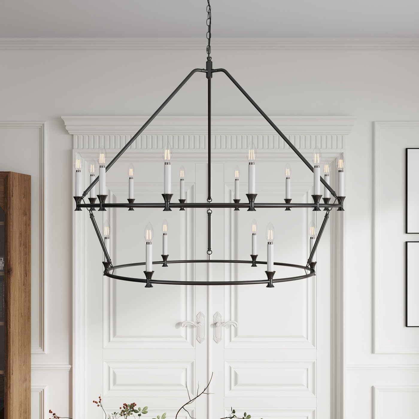 A large black iron chandelier featuring multiple tiers of candlestick lights.