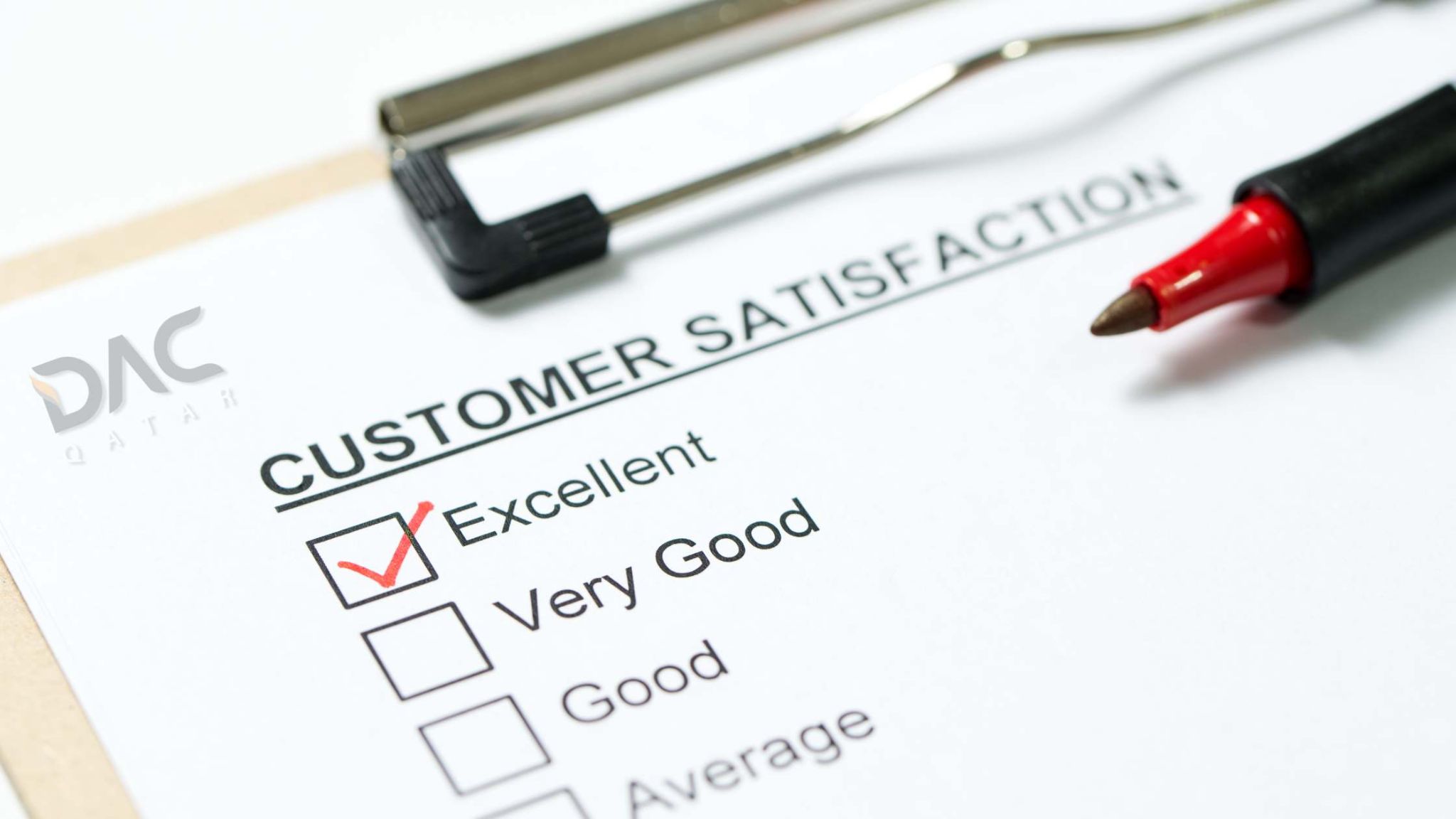 Customer satisfaction with DAC Qatar's custom branding and signage solutions. Customer satisfaction survey form with a red check mark on "Excellent" and DAC Qatar logo, representing custom branding and signage services in Qatar.