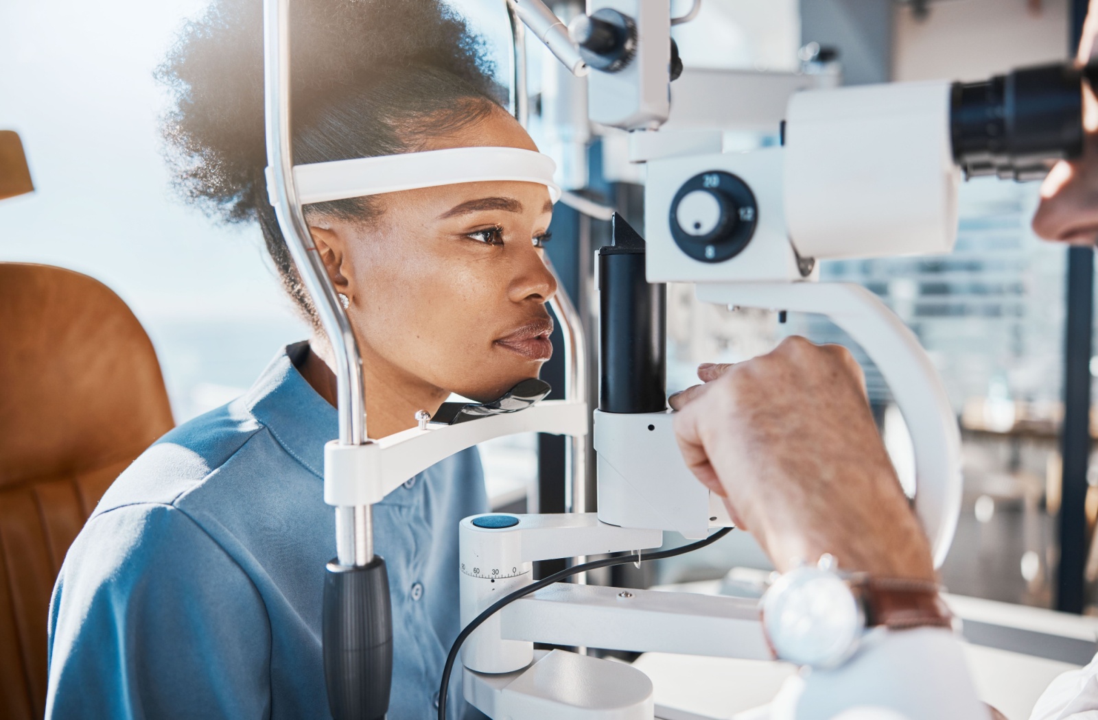 Patient undergoing an eye exam with an ophthalmologist.