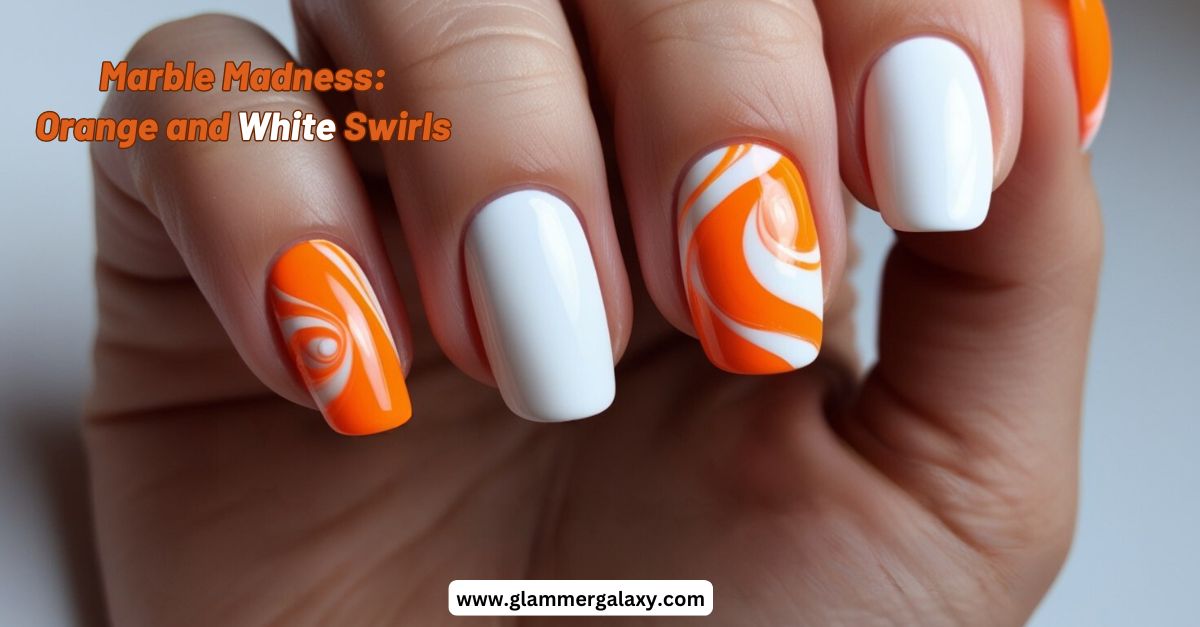 Orange Nails with a combination of white and orange swirls