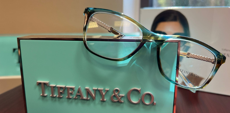 A pair of glasses on a display caseDescription automatically generated