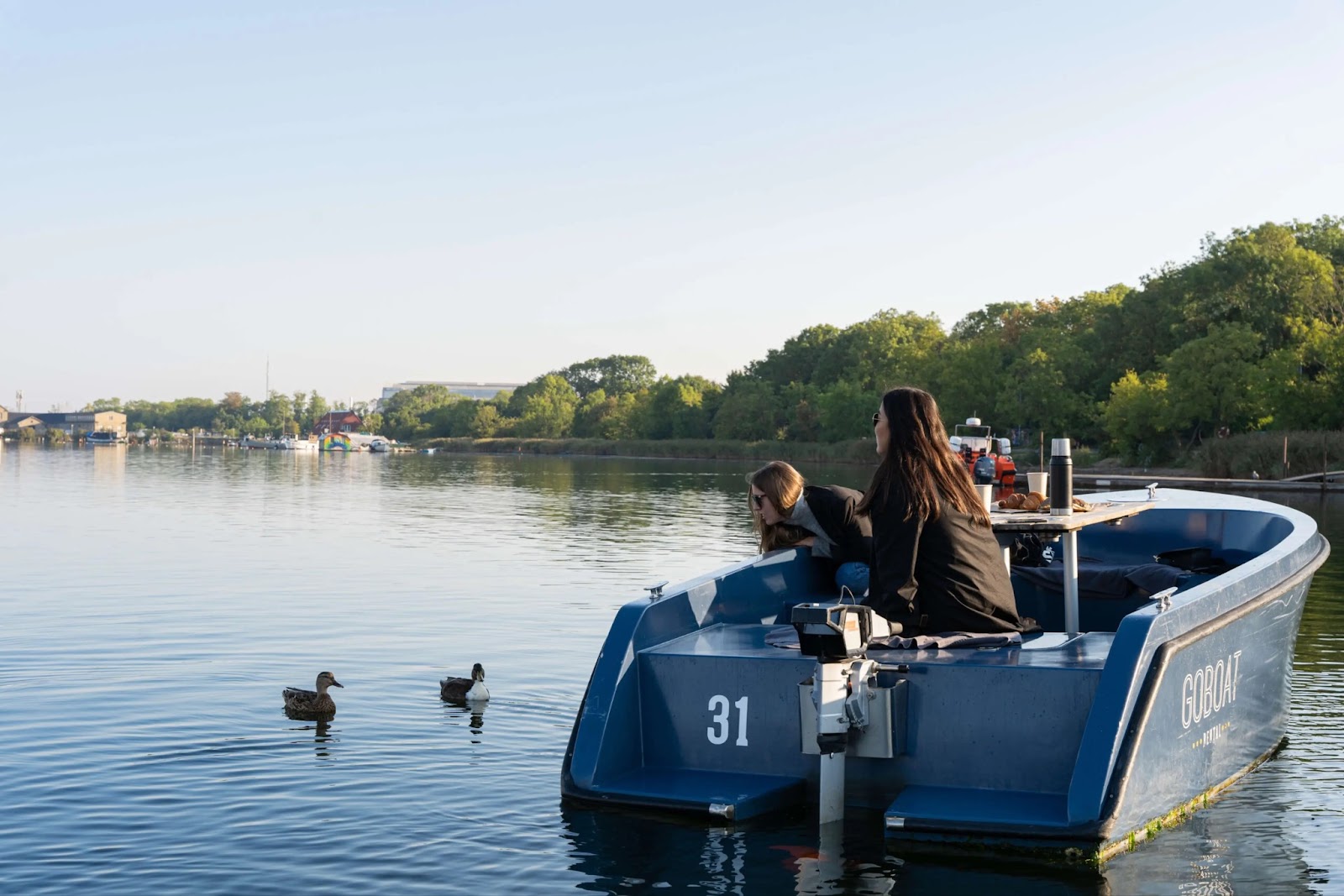 A couple renting a GoBoat as a date idea in London