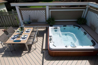 when to hire a michigan deck installer composite decking outdoor living space with dining area and hot tub custom built okemos