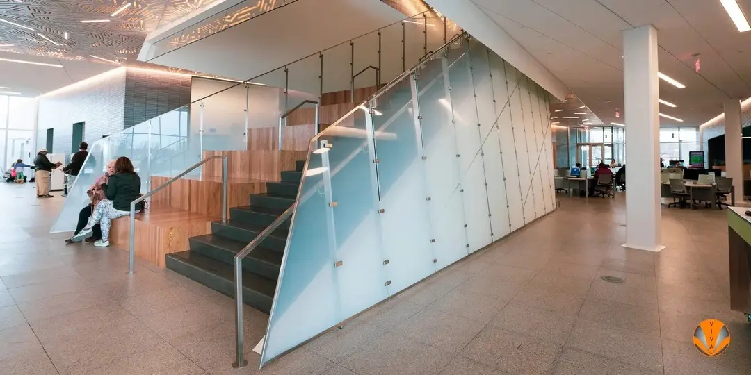 A traditional glass stairwell inside a public library. 