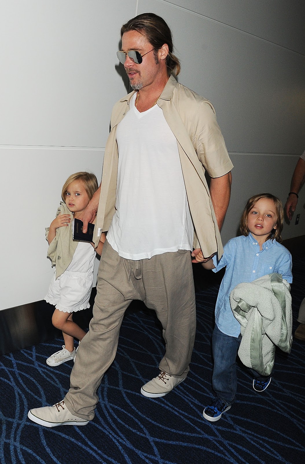 Brad Pitt, Knox Jolie-Pitt, and Vivienne Jolie-Pitt seen in Tokyo, Japan, on July 30, 2013. | Source: Getty Images