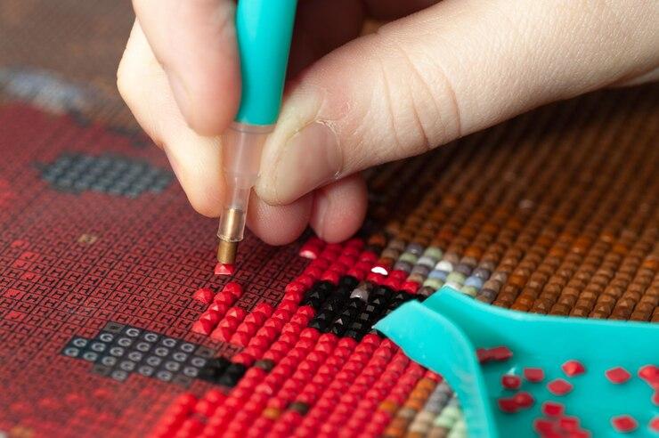 collecting-diamond-embroidery-diamond-mosaic-colored-crystals-needlework-creation-closeup_207254-266.jpg