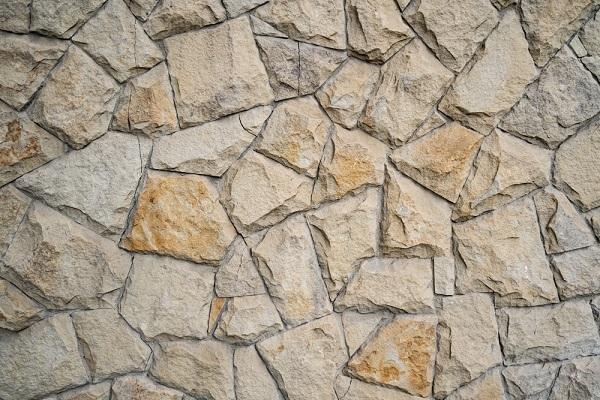 A close-up of a stone wall

Description automatically generated