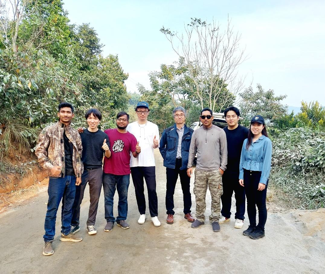 A group of people standing on a road

AI-generated content may be incorrect.
