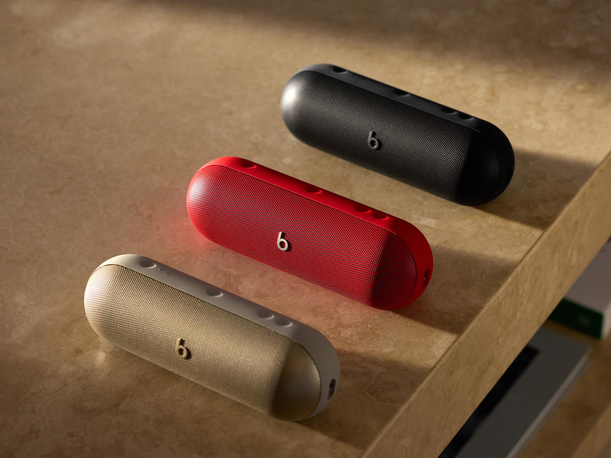 Beats Pill in three different colors.