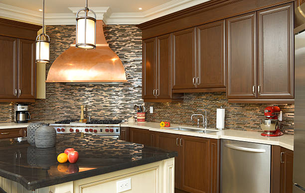 Modern kitchen with tall cabinets extending to the ceiling.