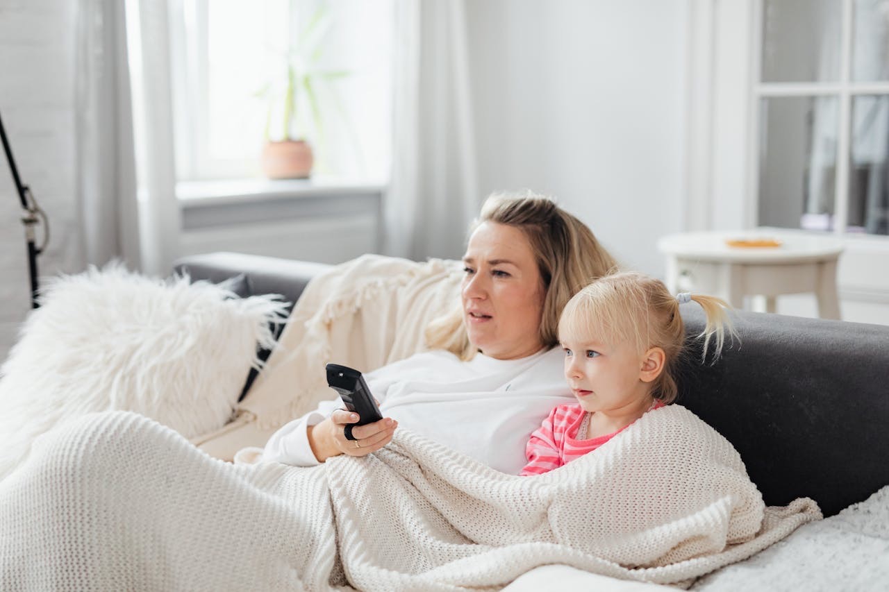 A girl sitting next to her mom // Healthier Baby Today