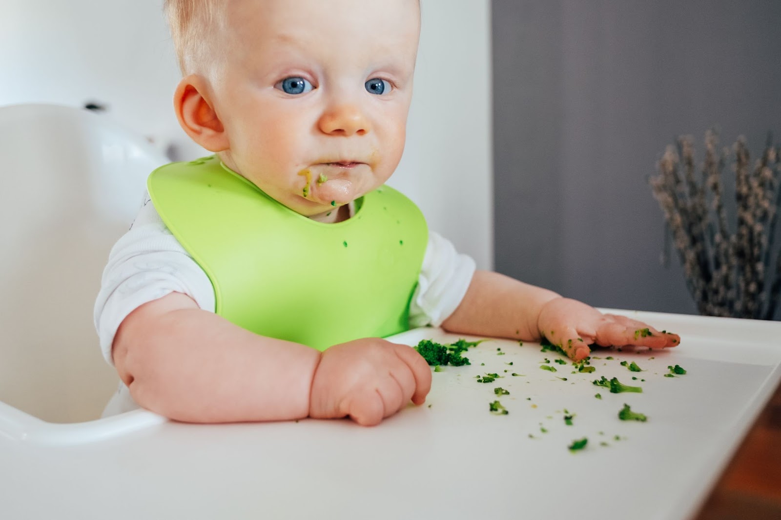 A little girl exploring her food