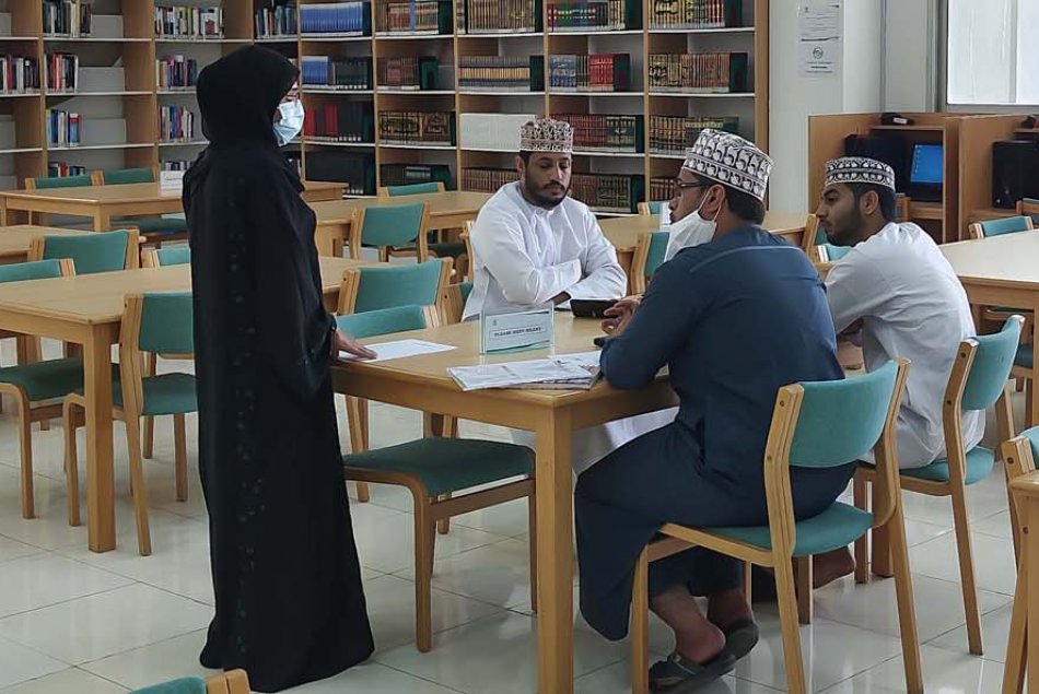 Students sitting in Al Ain University Library 