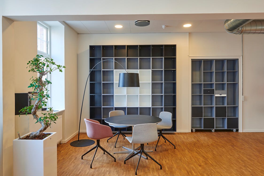 Free Bright and stylish office space with contemporary furniture and open shelving. Stock Photo