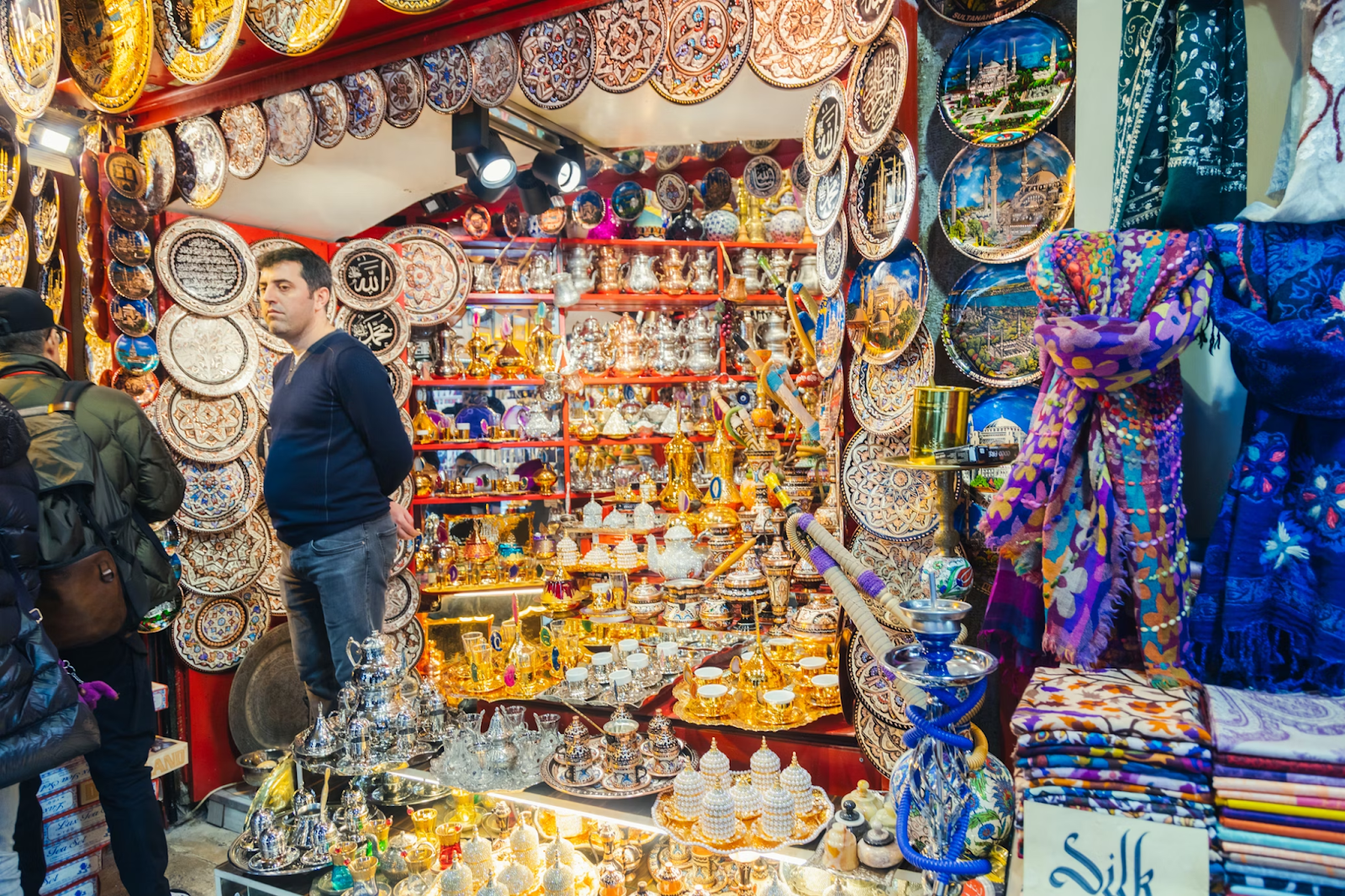 A person standing in a Saudi souvenir shop - (Credits Unsplash)