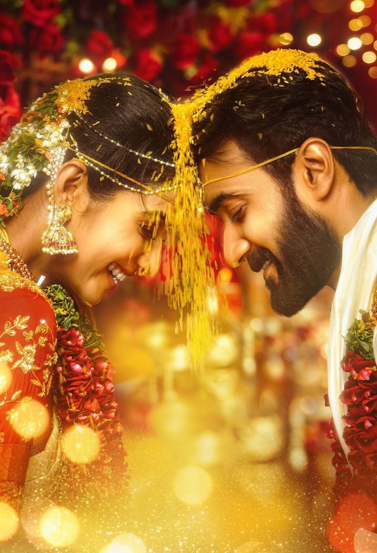 Romantic and intimate shot of the couple sharing a forehead touch after the Varmala exchange during their wedding.