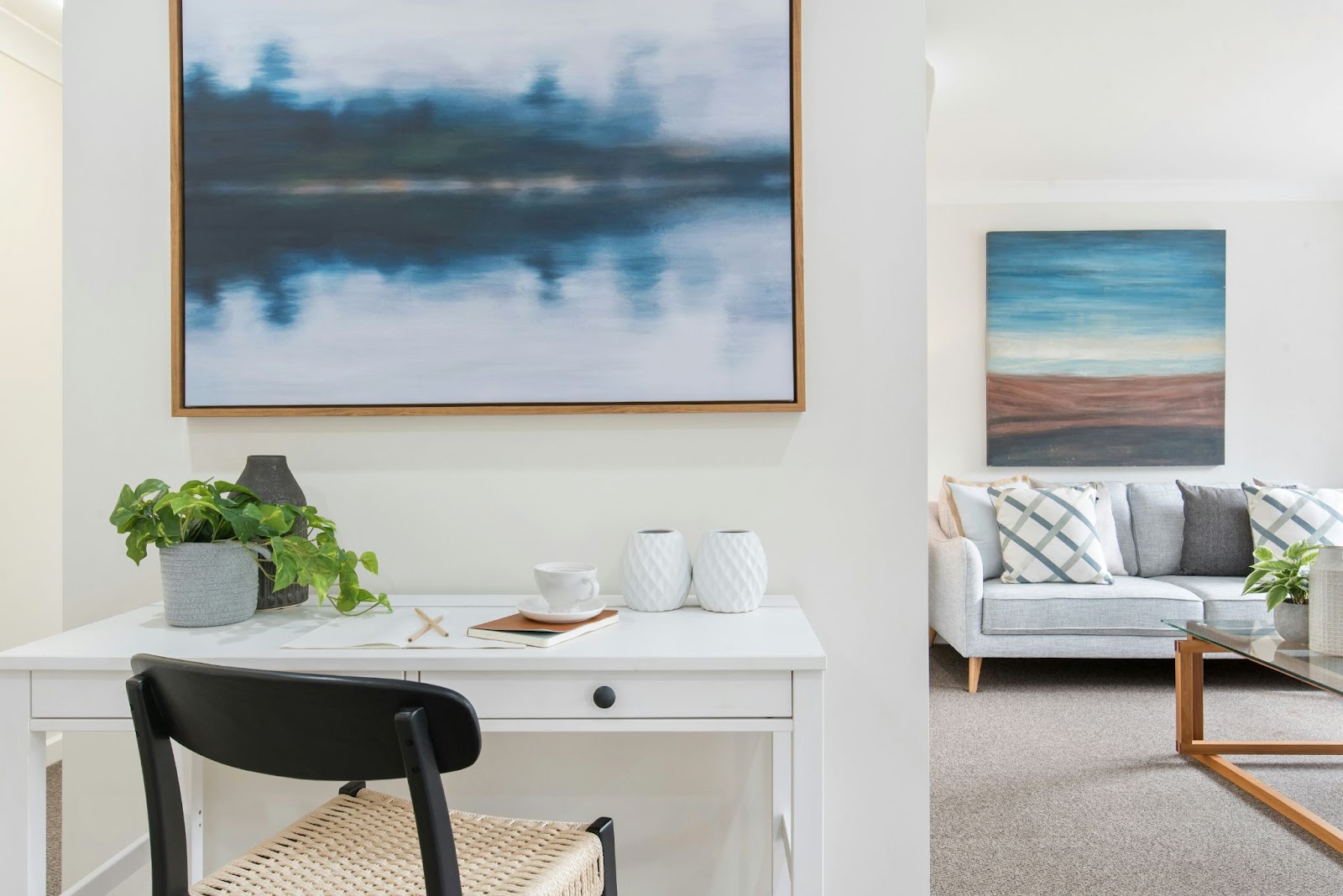 Interior of rental property living room with artwork on walls