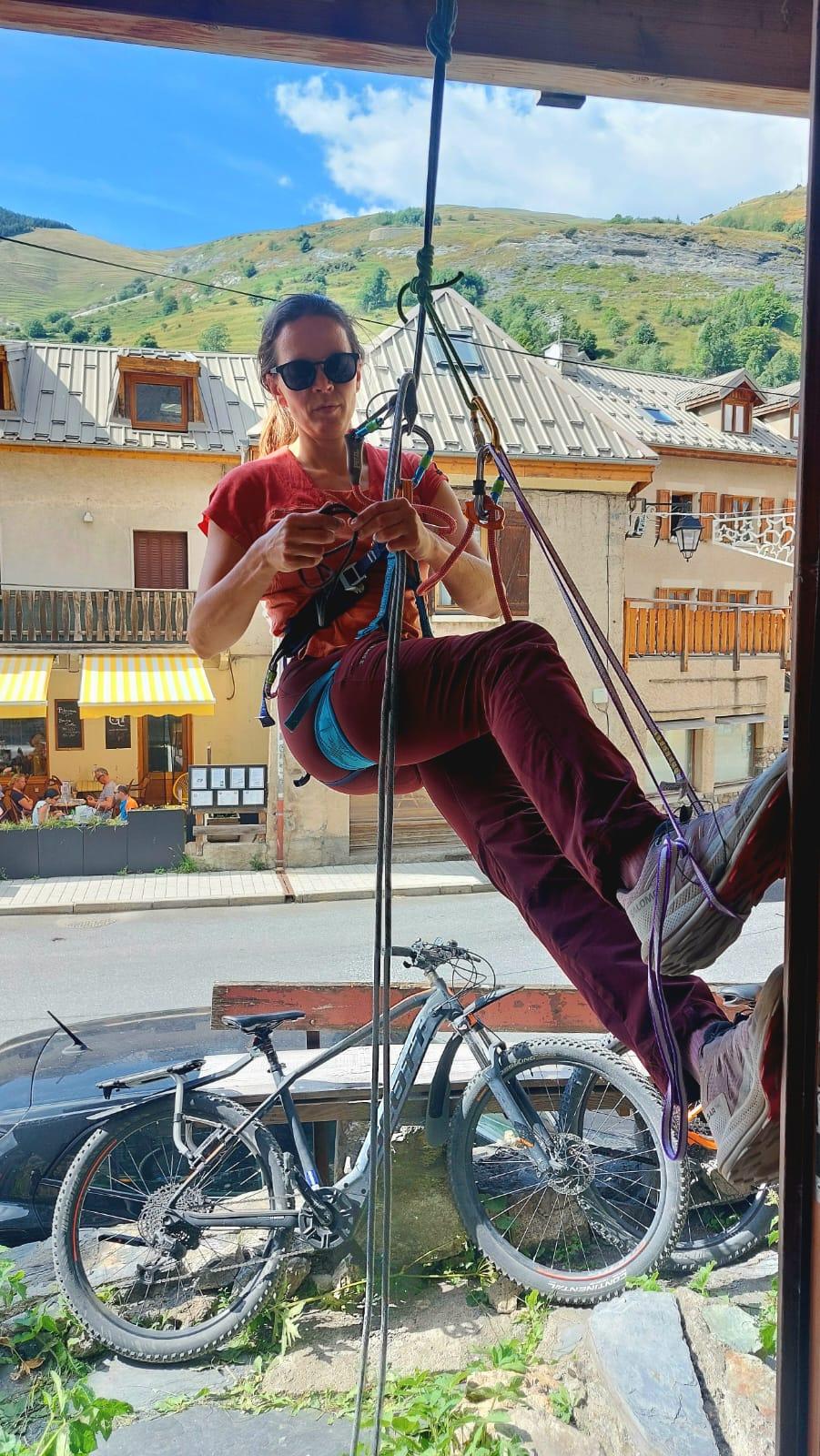 A person climbing a bikeAI-generated content may be incorrect.