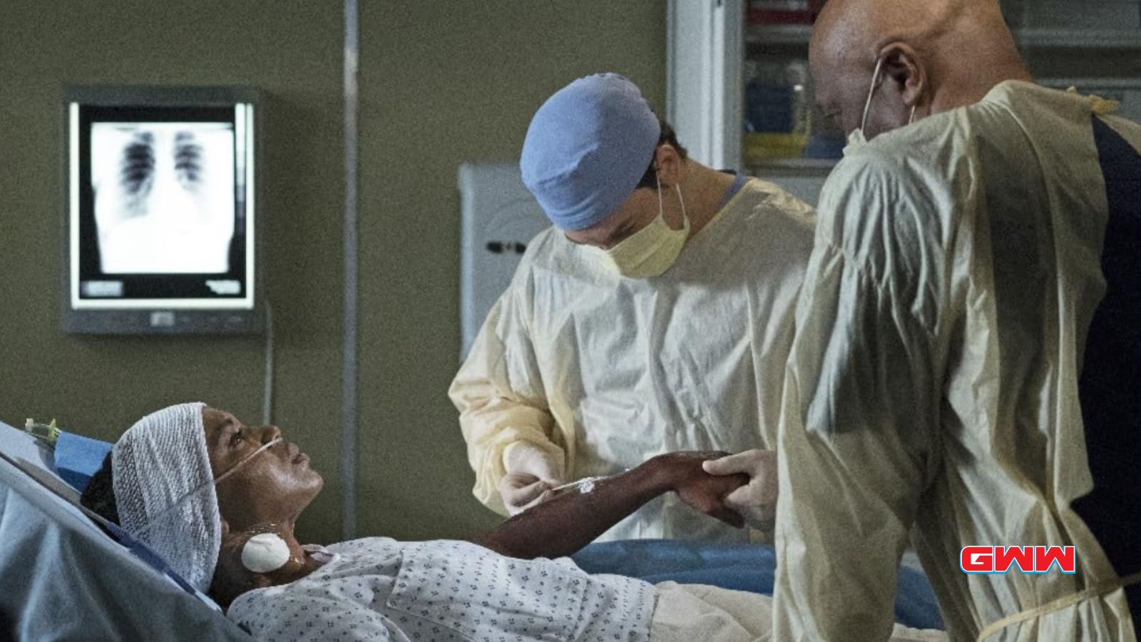 Doctors in scrubs and wearing masks checking on a patient, Grey's Anatomy Season 21