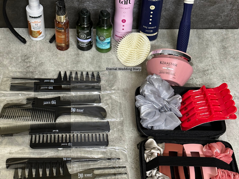 Hair styling products containing comb set, hair mask, hair conditioner and shampoo on a grey marble table