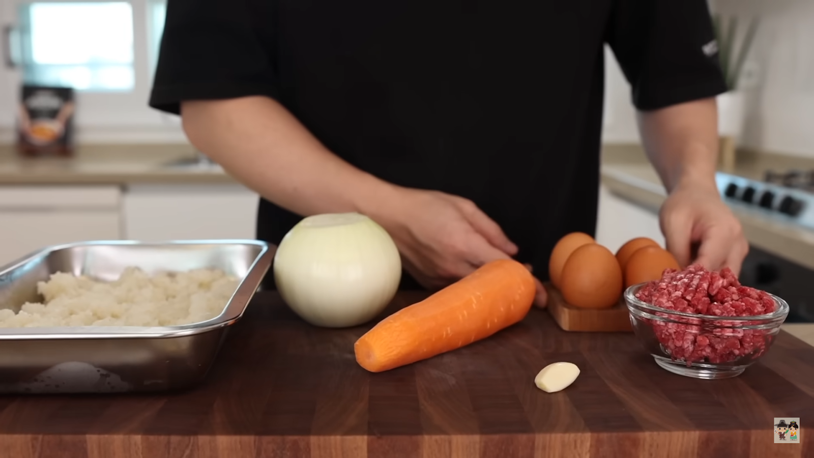 Aaron preparing ingredients for their Omurice recipe in a home kitchen
