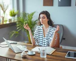 Image of Person practicing mindfulness in a workplace setting