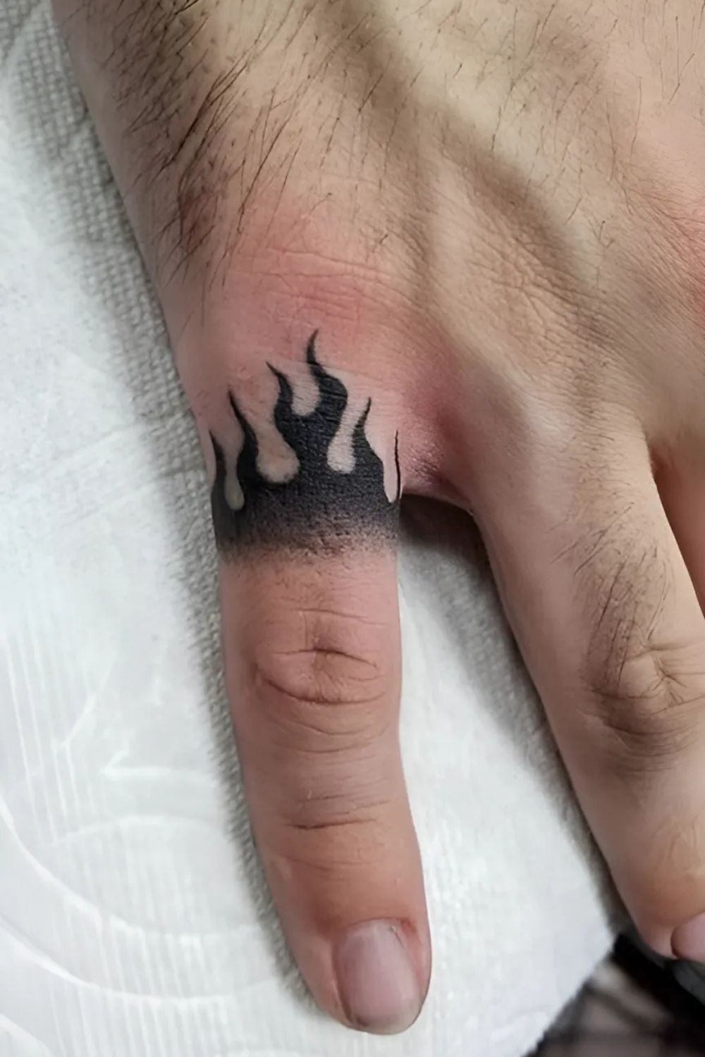 Flame Finger Tattoo