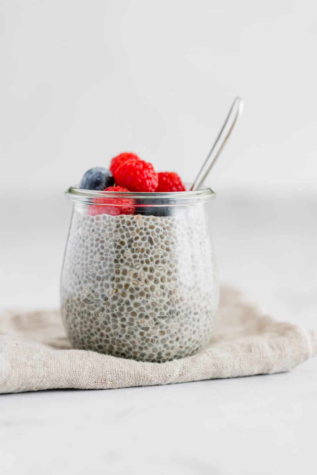 Overnight Oats in a jar with fresh berries and nuts