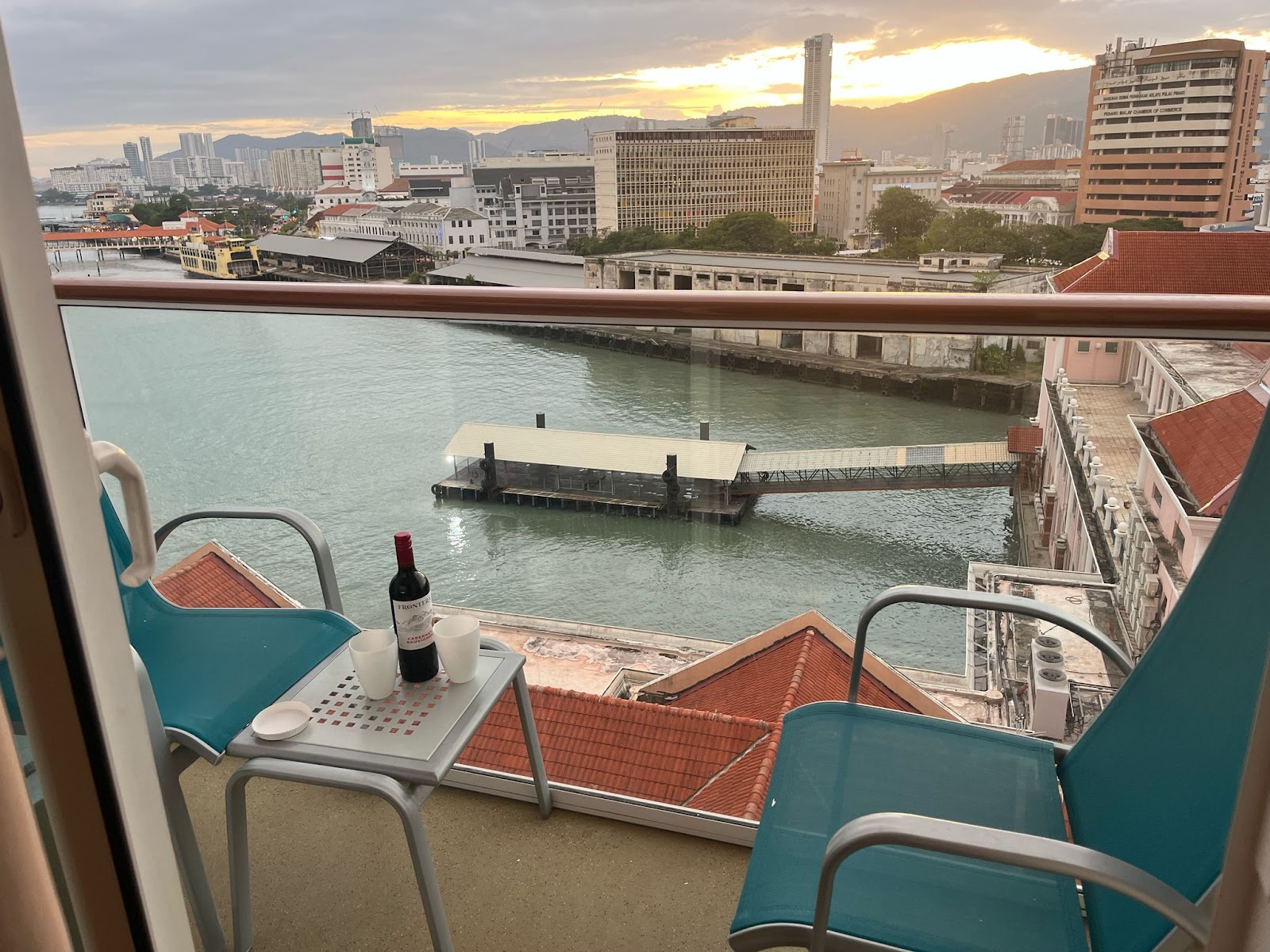 family holiday date night. save the date night. date night, singapore. balcony. cruise. bottle of red wine. 