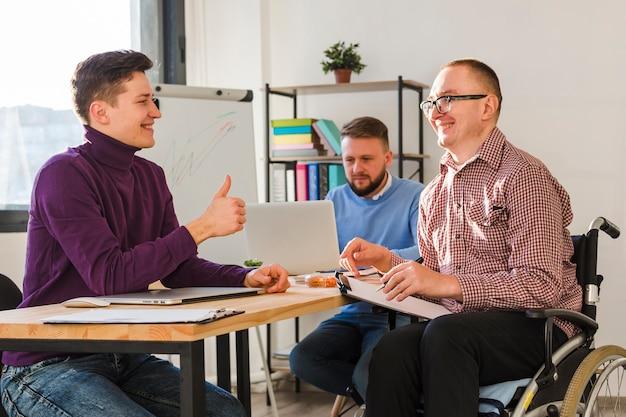 Group of men working together at the office