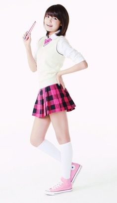 This contains an image of Sooyoung in a school uniform and holding a cell phone and posing for the camera