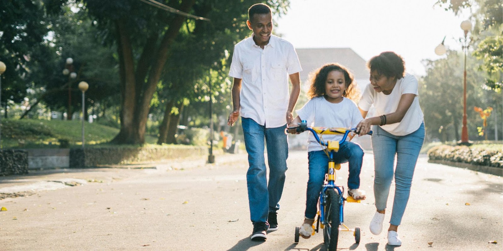 Man, wife, and child on a bicycle