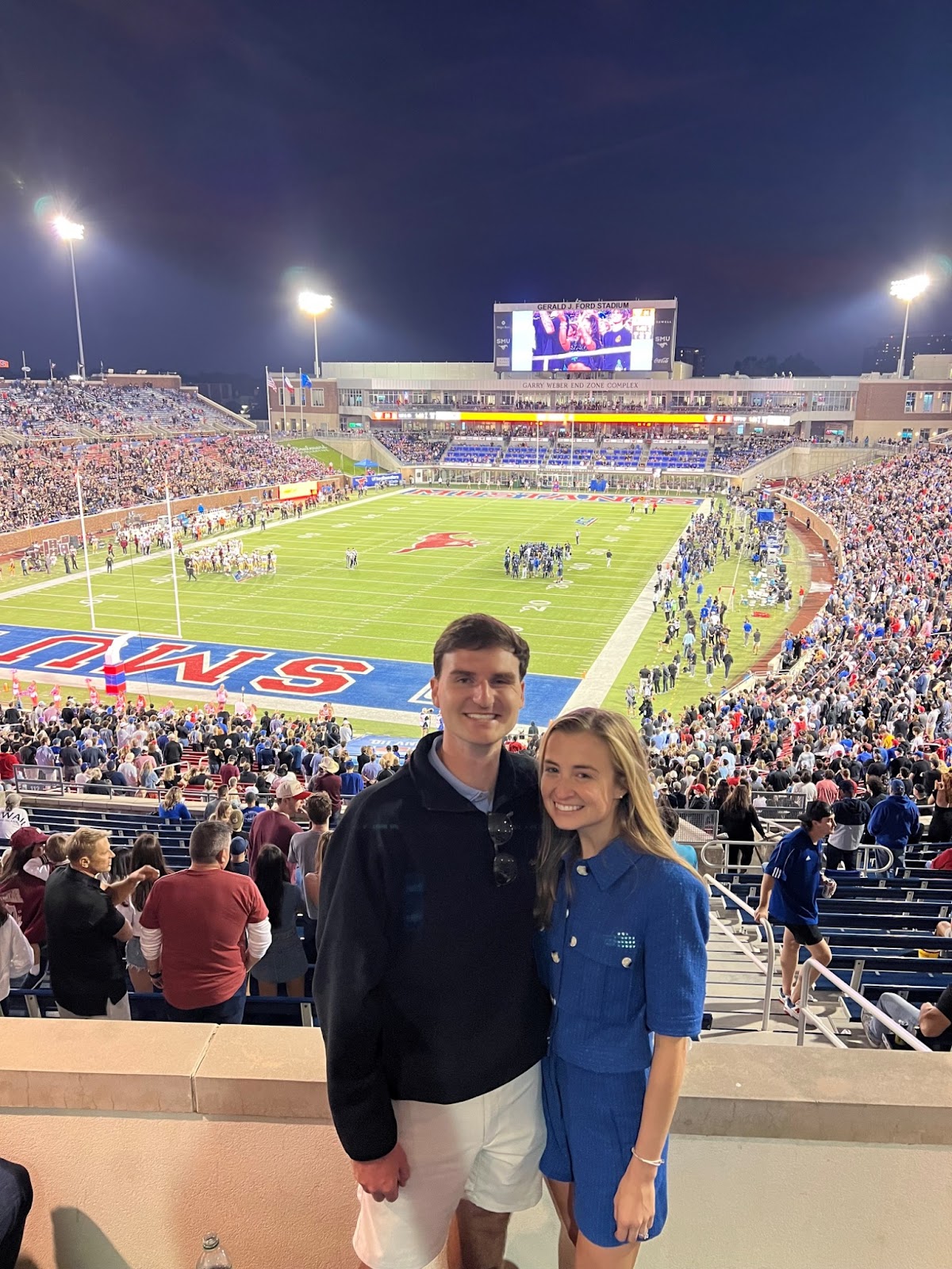 Nick and his wife, Mackenzie, at an SMU football game