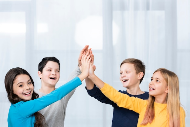 Side view kids air high five