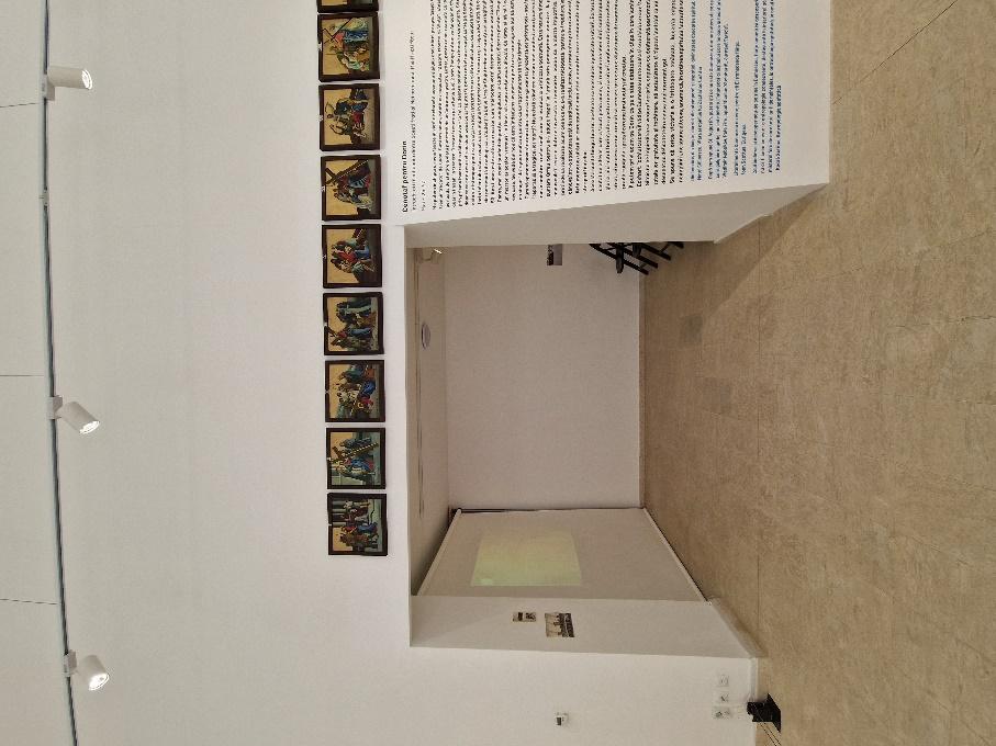 A room with a wall and a poster
AI-generated content may be incorrect.