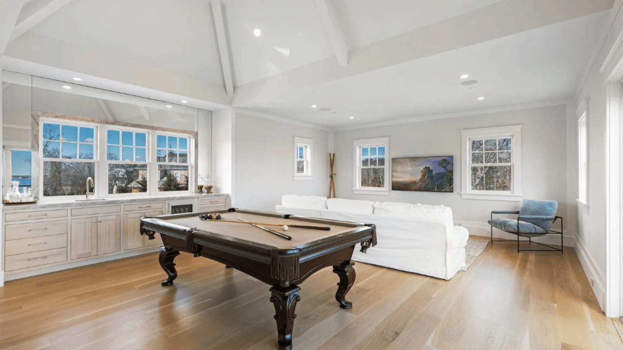 Tour This 8,094 Sq Ft Shingle-Style Waterfront Estate in Quogue, NY with Floating Staircase and 300-Bottle Wine Cellar