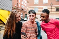 A picture of fans looking at the phone