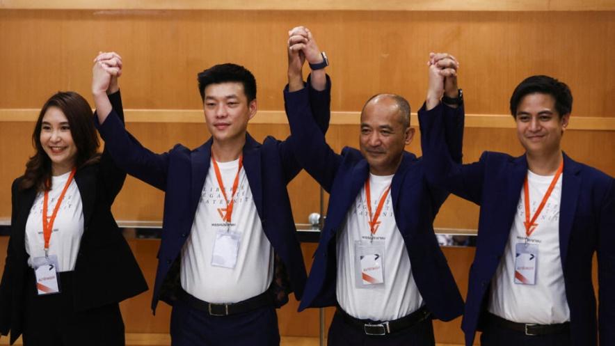 People's Party leader, Natthaphong Ruengpanyawut and party members pose for a picture during a press conference, announcing a new political party following the opposition Move Forward Party dissolutio