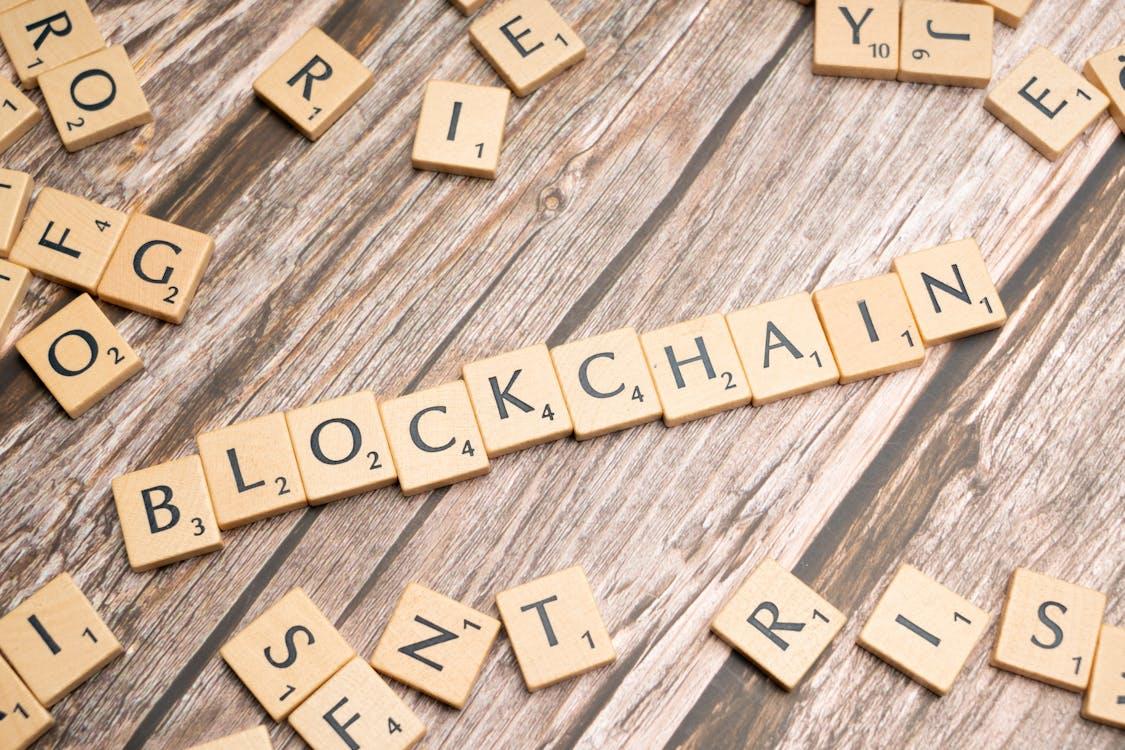 Free Blockchain technology and scrabble letters Stock Photo