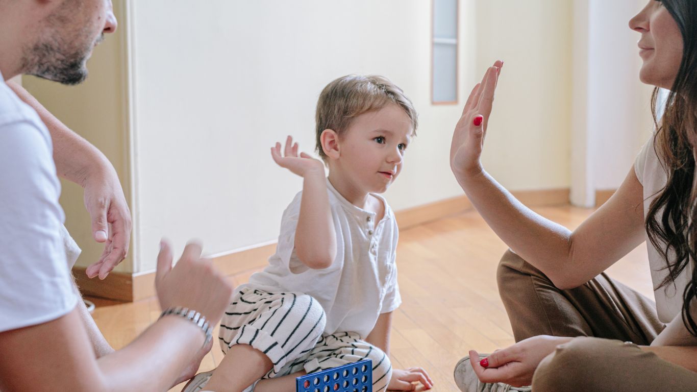 A family playing together with their child, emphasizing the importance of family stability and well-being under UAE Family Law reforms.