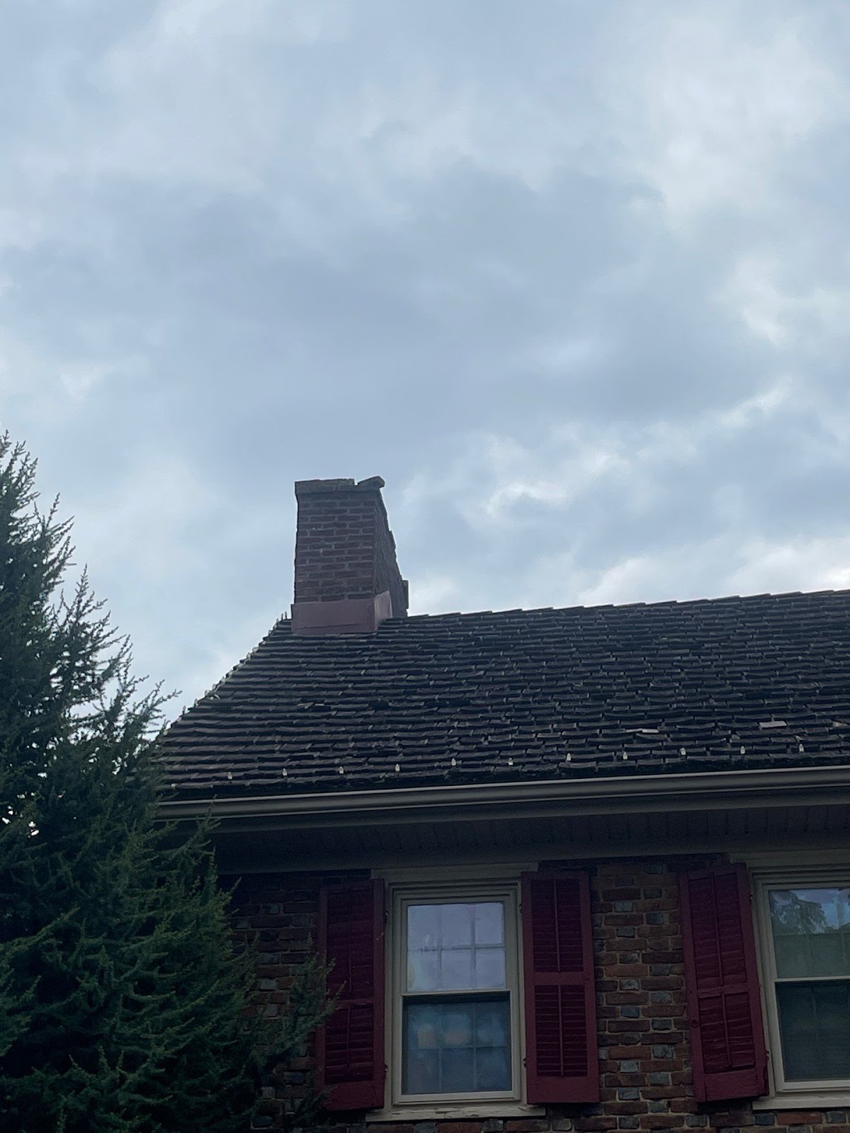 Wood shingles used in roof installation, highlighting natural aesthetics and traditional roofing options – explaining what is roof installation.