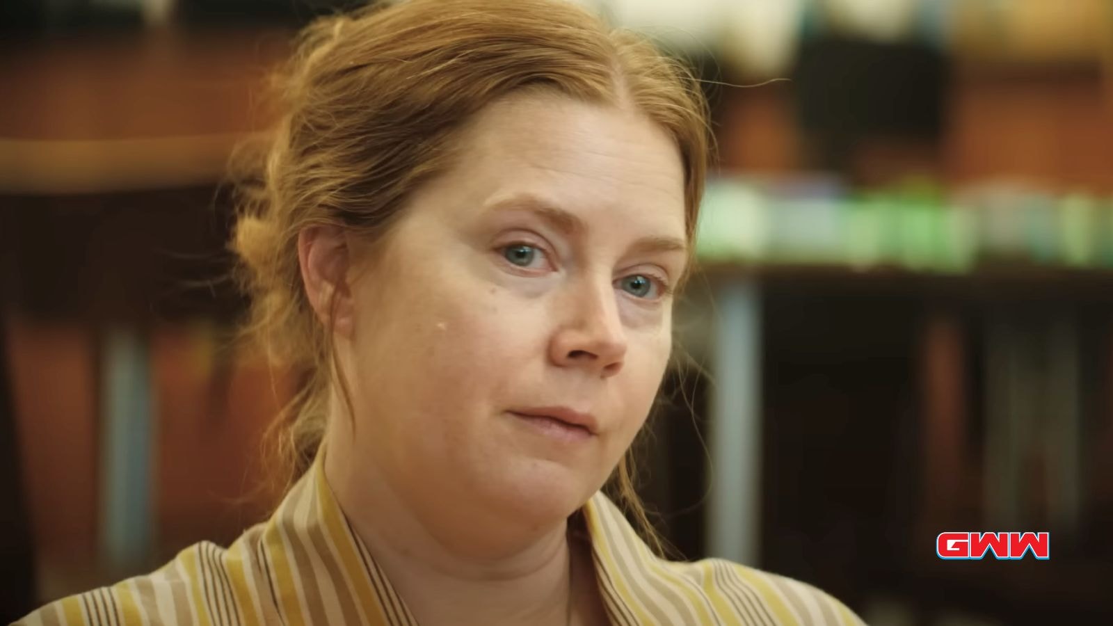 Amy Adams appearing weary and reflective in an indoor setting.