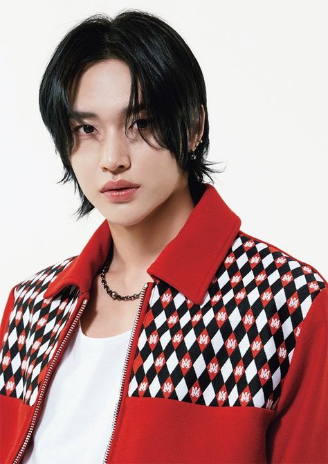 WONBIN of RIIZE wearing a red jacket mixed with a white and black design and a whiter inner vest 