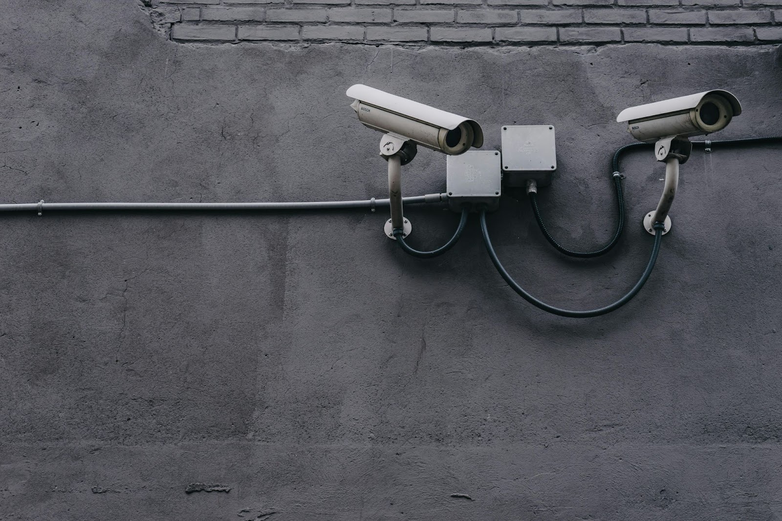 Two CCTV cameras on the wall