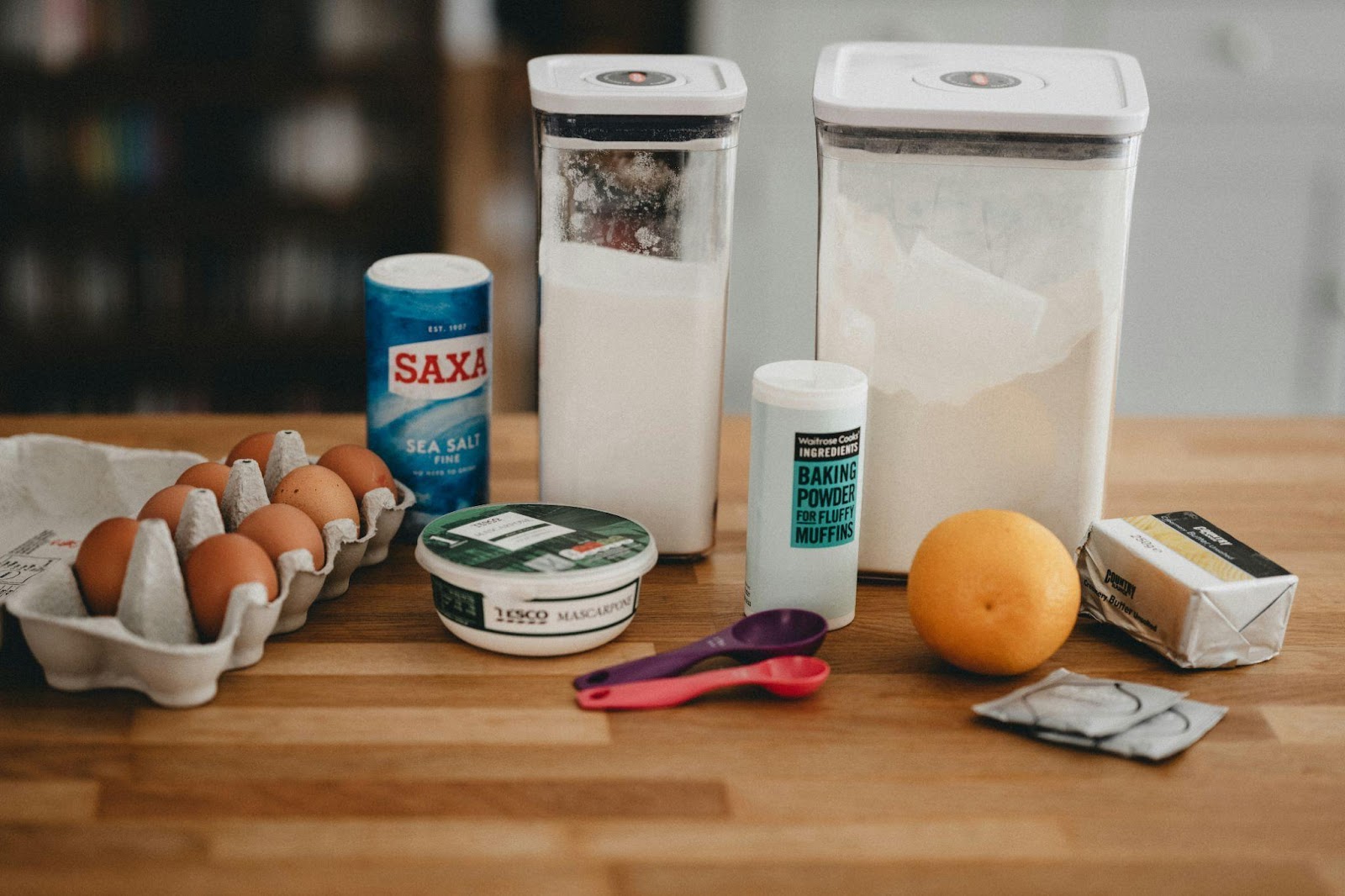 A few ingredients on a table with utensils