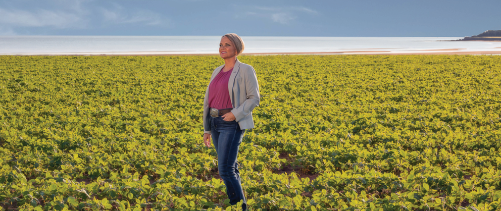 A person standing in a field of plants

AI-generated content may be incorrect.