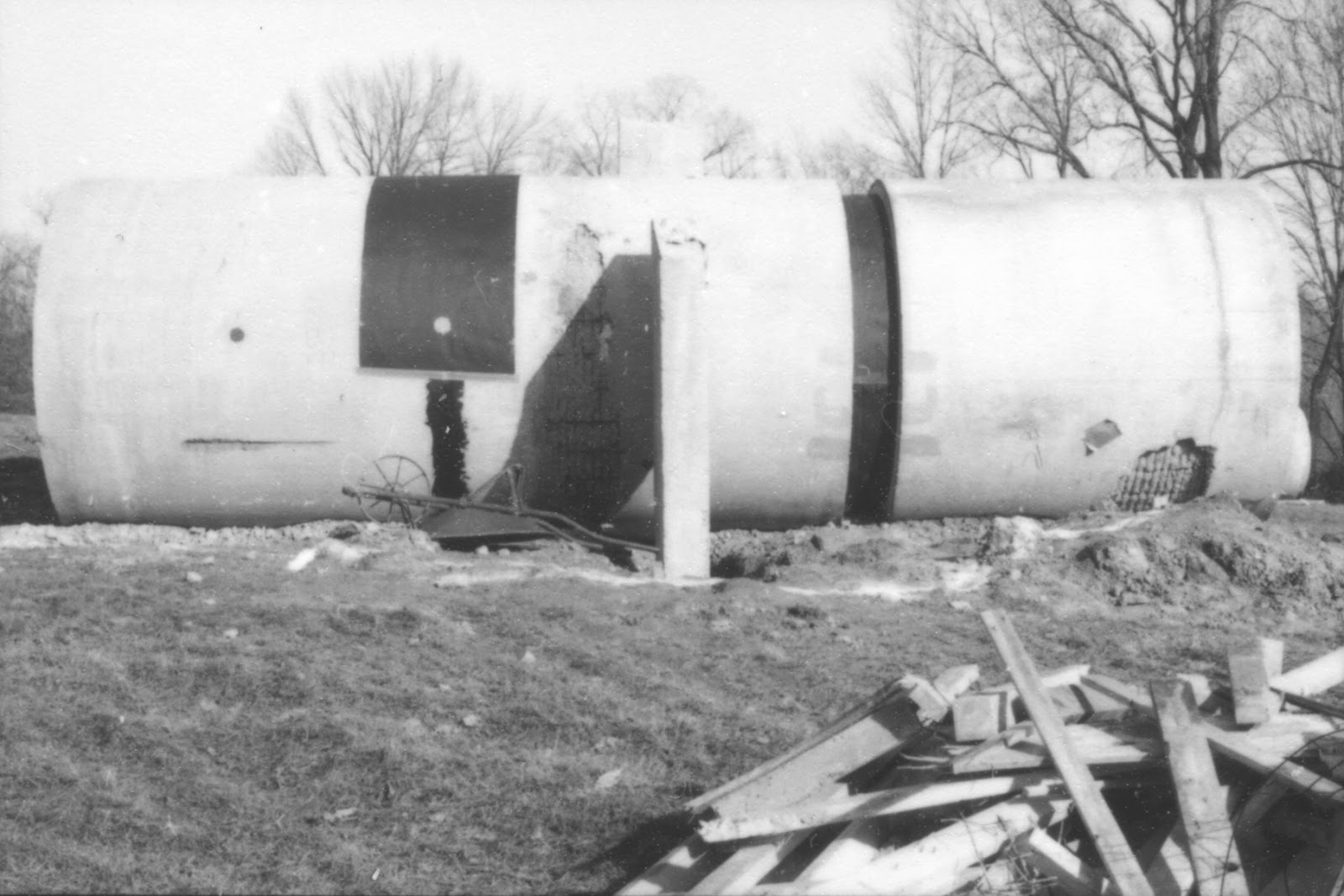 Image of the pipe portion of the sculpture during installation - Seams of East-West pipe patched with tar paper